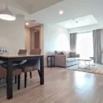 A woman enjoying her pet-friendly condo in Bangkok. 